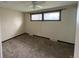 Cozy bedroom with a ceiling fan and natural light from the double windows at 1943 Meadow Dr # B2, Longmont, CO 80501