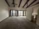 Large living room with sliding glass doors, carpet flooring and vaulted ceiling at 1943 Meadow Dr # B2, Longmont, CO 80501