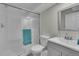 Bathroom with glass enclosed shower and a sink with modern fixtures and teal towel at 4694 S Ouray Way, Aurora, CO 80015