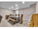 Basement dining room area with wooden table and chairs at 4694 S Ouray Way, Aurora, CO 80015