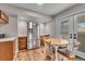 Dining area and kitchen with new stainless steel refrigerator at 4694 S Ouray Way, Aurora, CO 80015