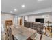 Open basement living room area with dining area and living area at 4694 S Ouray Way, Aurora, CO 80015