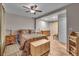 Spacious bedroom features a ceiling fan, hardwood floors, and ample closet space at 4694 S Ouray Way, Aurora, CO 80015