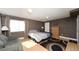 Contemporary bedroom with modern furnishings and a large window at 15300 Cavanaugh Rd, Keenesburg, CO 80643
