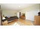 Serene bedroom with warm tones, hardwood floors, and ample closet space at 15300 Cavanaugh Rd, Keenesburg, CO 80643