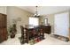 Warm and inviting dining area with wooden table set and natural light at 15300 Cavanaugh Rd, Keenesburg, CO 80643