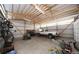 Large garage or shed, featuring a pickup truck and yard equipment at 15300 Cavanaugh Rd, Keenesburg, CO 80643