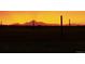A sunset image over the mountains at 15300 Cavanaugh Rd, Keenesburg, CO 80643