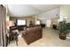 Open concept living room with hardwood floors and a seamless flow into the kitchen at 15300 Cavanaugh Rd, Keenesburg, CO 80643