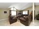 Cozy living room with vaulted ceiling, neutral walls, comfortable seating, and large windows for natural light at 15300 Cavanaugh Rd, Keenesburg, CO 80643
