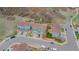 Aerial view of townhomes showcasing well-kept landscaping, driveways, and surrounding neighborhood at 1552 Live Oak Rd, Castle Rock, CO 80104