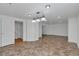 Finished basement with an open floorplan and adjacent bathroom with a sink at 1552 Live Oak Rd, Castle Rock, CO 80104