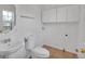 Bright bathroom featuring ceramic tile flooring, toilet, and a vessel sink at 1552 Live Oak Rd, Castle Rock, CO 80104