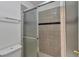 Cozy bathroom featuring gray tile and a glass-enclosed shower at 1552 Live Oak Rd, Castle Rock, CO 80104