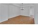 Bright formal dining room features contemporary lighting and hardwood floors at 1552 Live Oak Rd, Castle Rock, CO 80104