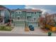 A lovely two-story townhome with a balcony above the garages and well-maintained landscaping at 1552 Live Oak Rd, Castle Rock, CO 80104