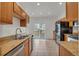 Eat-in kitchen featuring tile floors, stainless steel appliances, and wood cabinets at 1552 Live Oak Rd, Castle Rock, CO 80104