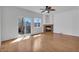 Bright living room with a ceiling fan, fireplace and access to a deck at 1552 Live Oak Rd, Castle Rock, CO 80104