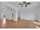 Open living room featuring wood floors, bright lighting, and neutral colored walls at 1552 Live Oak Rd, Castle Rock, CO 80104