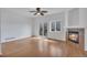 Bright living room with a ceiling fan, fireplace and access to a deck at 1552 Live Oak Rd, Castle Rock, CO 80104
