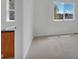Bright bedroom featuring neutral carpeting and large window at 1552 Live Oak Rd, Castle Rock, CO 80104