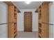 Spacious walk-in closet with custom wooden shelving at 1552 Live Oak Rd, Castle Rock, CO 80104