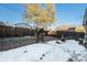 Backyard with detached garage and snow at 1961 W Kentucky Ave, Denver, CO 80223