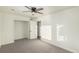 Bright bedroom with neutral walls and carpet flooring at 1961 W Kentucky Ave, Denver, CO 80223