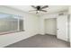 Bright bedroom with neutral walls and carpet flooring at 1961 W Kentucky Ave, Denver, CO 80223