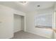 Bright bedroom with neutral walls and carpet flooring at 1961 W Kentucky Ave, Denver, CO 80223