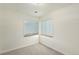 Bright bedroom with neutral walls and carpet flooring at 1961 W Kentucky Ave, Denver, CO 80223