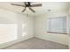 Bright bedroom with neutral walls and carpet flooring at 1961 W Kentucky Ave, Denver, CO 80223