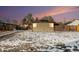 House exterior with snow covered yard at 1961 W Kentucky Ave, Denver, CO 80223