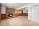Finished basement with a brick fireplace and wood paneling, perfect for a cozy retreat at 757 Norfolk Way, Aurora, CO 80011