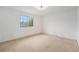 Spacious bedroom with neutral carpet, a large window for natural light, and ample space at 757 Norfolk Way, Aurora, CO 80011