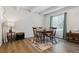 Dining area with wood floor, table, and chairs, near kitchen at 9725 E Harvard Ave # 349, Denver, CO 80231