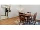 Dining area with wood floor, table, and chairs, near kitchen at 9725 E Harvard Ave # 349, Denver, CO 80231