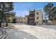 Building exterior with snowy landscape in front at 9725 E Harvard Ave # 349, Denver, CO 80231