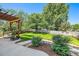 Lush backyard featuring a patio with a grill, a fire pit, manicured lawn, and mature trees offers a serene escape at 10289 Dresden St, Firestone, CO 80504