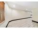 Large finished basement with recessed lighting, wood floors, and a wet bar at 10289 Dresden St, Firestone, CO 80504