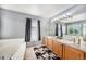 Bathroom with double vanity, soaking tub, neutral tones, and great lighting for a relaxing and functional space at 10289 Dresden St, Firestone, CO 80504