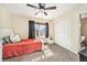 Bright bedroom features a bed, closet, and a large window with natural light at 10289 Dresden St, Firestone, CO 80504