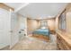 Basement bedroom featuring a bed, dresser, and a large window with natural light at 10289 Dresden St, Firestone, CO 80504