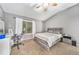 Serene bedroom with neutral colors, large window, and a ceiling fan creating a calming atmosphere at 10289 Dresden St, Firestone, CO 80504