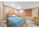 Comfortable bedroom featuring wood-look bed frame, soft bedding, and natural light from the windows at 10289 Dresden St, Firestone, CO 80504