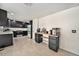 Modern kitchen featuring black cabinetry, stainless steel appliances, and a functional coffee bar area at 10289 Dresden St, Firestone, CO 80504