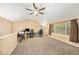 Comfortable loft space with vaulted ceilings, neutral walls, and plenty of natural light from a large window at 10289 Dresden St, Firestone, CO 80504