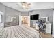 Comfortable main bedroom showcasing neutral tones, ceiling fan, and ample space for a relaxed retreat at 10289 Dresden St, Firestone, CO 80504
