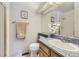 Neutral bathroom featuring a granite countertop, undermount sink and decorative accents at 16261 W Ellsworth Ave, Golden, CO 80401