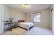 Cozy bedroom with neutral carpet, a window and adjacent closet at 16261 W Ellsworth Ave, Golden, CO 80401